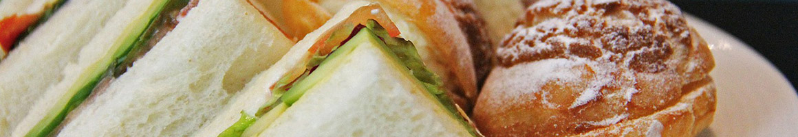 Eating Sandwich at Big Apple Bagels restaurant in Bellevue, WA.
